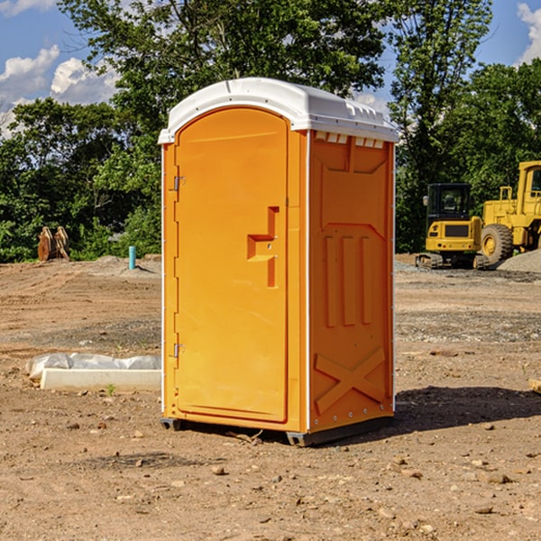 what is the cost difference between standard and deluxe portable toilet rentals in Town Creek